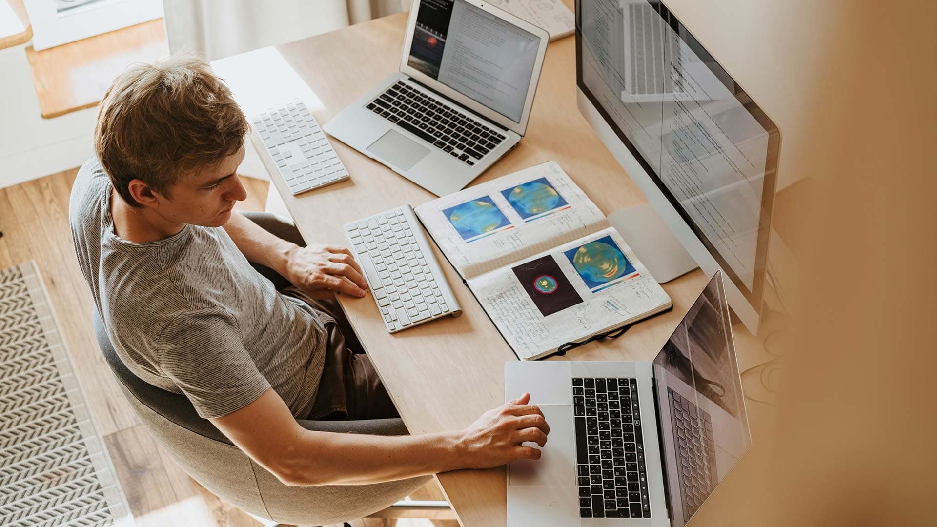 A developer reviewing an outdated business website alongside its rebuilt version